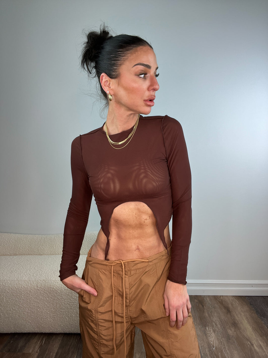 LONG SLEEVE MESH TOP WITH FRONT U CUT DETAIL. NO LINING, SEE THROUGH. CHOCOLATE BROWN COLOR 
